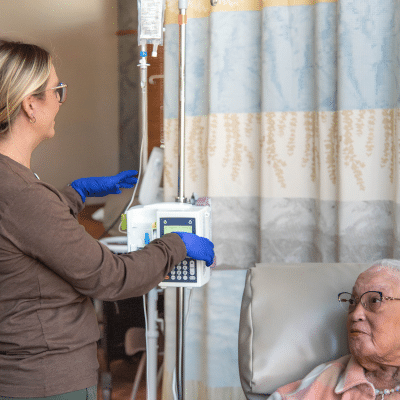 Nurse assisting patient with treatment, representing how to detect blood cancer before symptoms appear